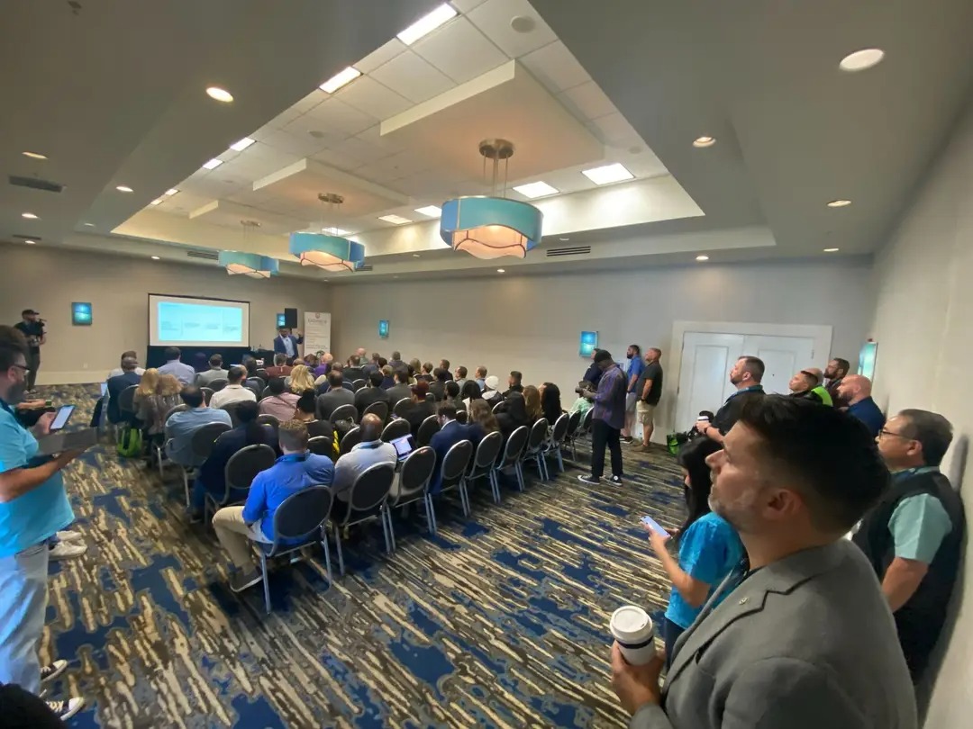Mike speaking at a packed session
